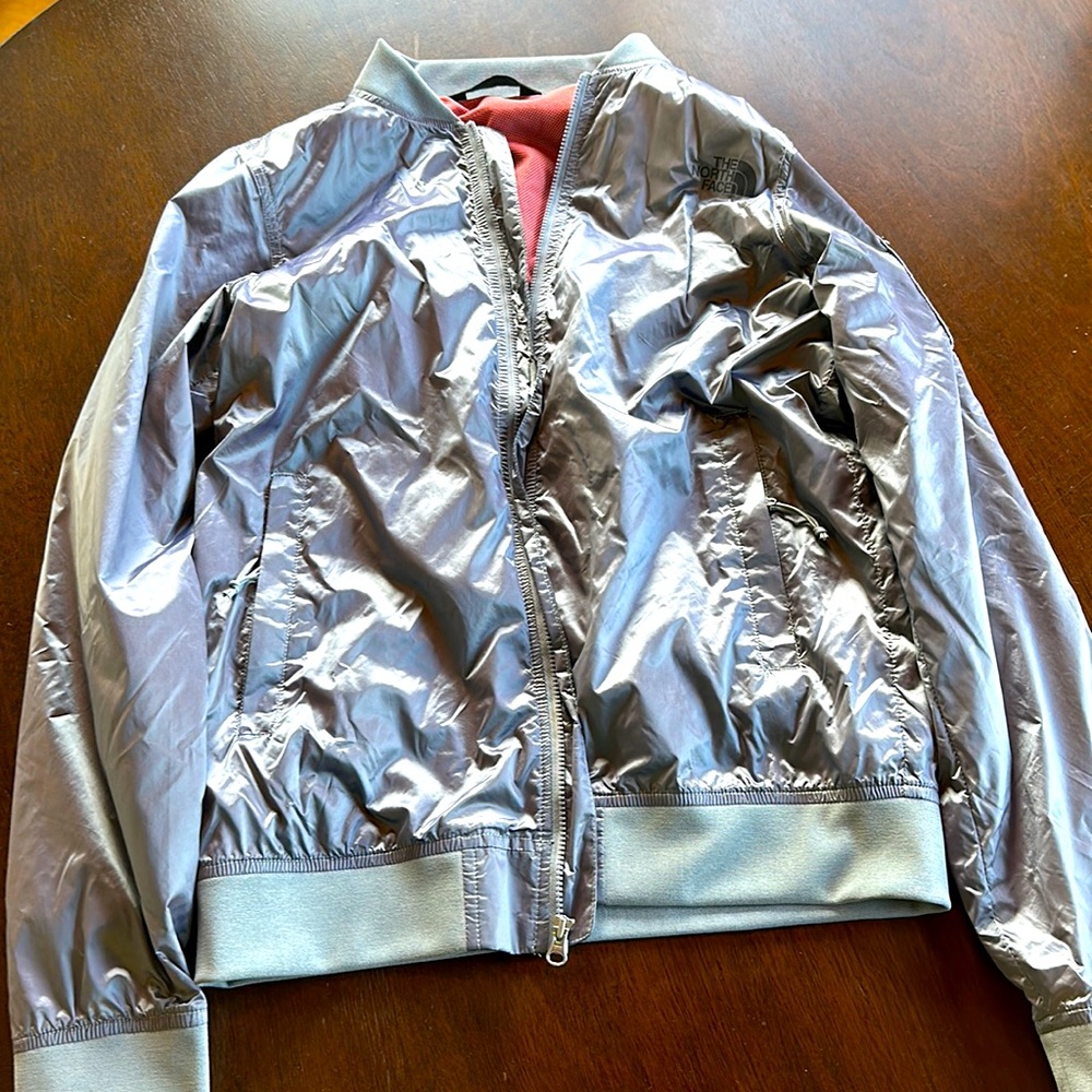 XS North Face metallic silver spring jacket. Excellent condition.